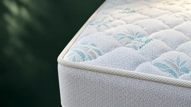 Illustrative close view of Tanfoam Premium quilting and edge piping